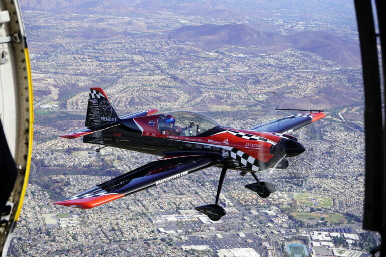 Rob Holland, piloting his MXS-RH, next to the Golden Knights, performs aerobatics during the 2022 Marine Corps Air Station Miramar Air Show at MCAS Miramar, San Diego, California, Sept. 24, 2022. Holland has been performing at air shows for over 18 years. The theme for the 2022 MCAS Miramar Air Show, “Marines Fight, Evolve and Win,” reflects the Marine Corps’ ongoing modernization efforts to prepare for future conflicts. (U.S. Marine Corps photo by Pfc. Arthur Shores)